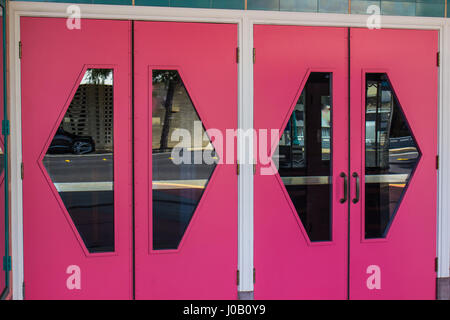 Bright Pink Doors With Glass Window Cutouts Stock Photo