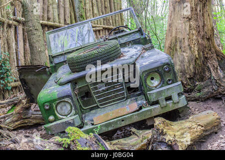 Abandoned and destroyed Land Rover Defender Series III (inspired by Jurassic Park), at Dierenpark Amersfoort Dino Park Stock Photo