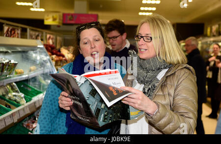 Female shoppers in Waitrose supermarket, Alton, Hampshire, UK, 25.03.2017, part of a flash mob singing opera. Stock Photo
