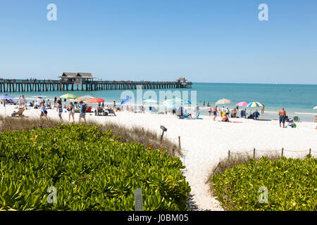 Naples, Fl, USA - March 18, 2017: Beautiful white sand beach at the Gulf of Mexico coast in Naples. Florida, United States Stock Photo