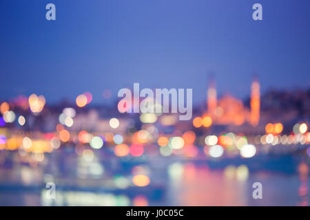 Blurred bokeh image of Istanbul with mosque over the Bosphorus strait in Istanbul, Turkey Stock Photo