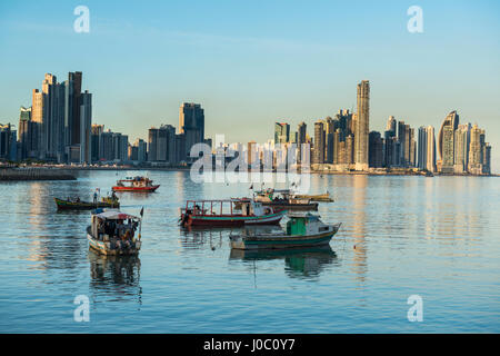 Little fishing boats and the skyline of Panama City, Panama, Central America Stock Photo