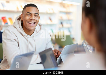 University students using laptops and digital tablet, working together Stock Photo