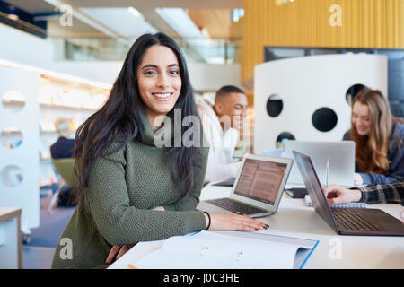 University students using laptops and digital tablet, working together Stock Photo