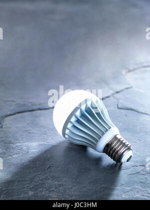 LED energy efficient light bulb, illuminated Stock Photo
