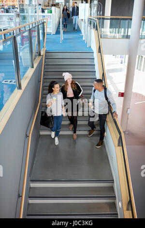 University students going down stairs Stock Photo