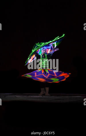UAE / DUBAI 9/21/2012 - Local dancer with luminous suit Stock Photo