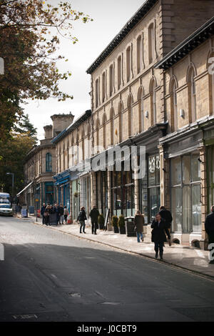 Shoppers on Victoria Rd, Saltaire, Bradford, West Yorkshire Stock Photo