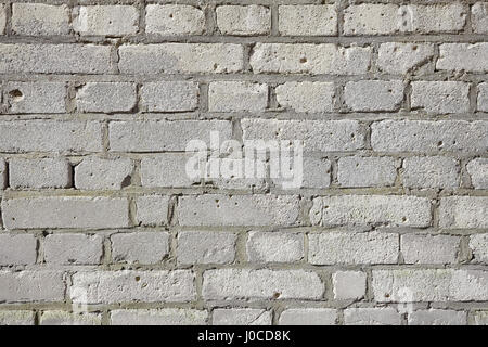 Picture of an old gray weathered brick wall, background or texture. Stock Photo