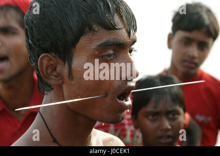 Man with needle pierced in cheeks, charak pooja, west bengal, india, asia Stock Photo