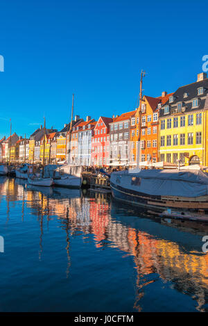 COPENHAGEN, DENMARK - MARCH 11, 2017: Copenhagen Nyhavn canal and promenade with its colorful facades, 17th century waterfront is an entertainment dis