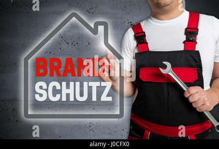 Brandschutz (in german Fire protection) with house touchscreen is operated by technician. Stock Photo