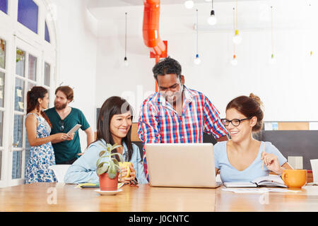 Business team coworking together using laptop computer Stock Photo