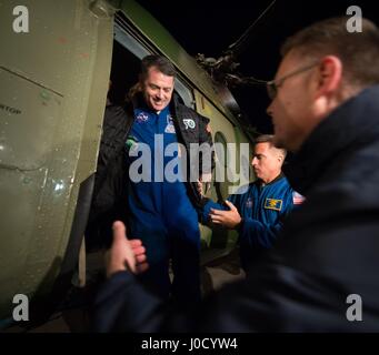 Zhezkazgan, Kazakhstan. 10th Apr, 2017. NASA astronaut Shane Kimbrough, left, is helped off the MI-8 helicopter at Karaganda Airport after landing in a remote area April 10, 2017 near Zhezkazgan, Kazakhstan. The spacecraft returned carrying the International Space Station Expedition 50 mission crew after 173 days in space. Credit: Planetpix/Alamy Live News Stock Photo