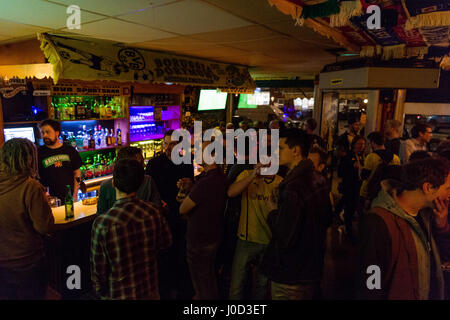 Hamburg, Germany. 11th Apr, 2017. Fans of the Bundesliga soccer club Borussia Dortmund stand in the BVB sports bar 'Dreissig' (lit. 'Thirty') in Hamburg, Germany, 11 April 2017. The match between Borussia Dortmund and AS Monaco was cancelled after explosions near the BVB team bus and rescheduled to 12 April 2017. Photo: Christophe Gateau/dpa/Alamy Live News Stock Photo