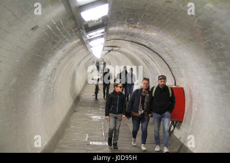 London, UK. 12th Apr, 2017. London, United Kingdom - April 12: People seen walking through the Greenwich foot tunnel on April 12 2017. The tunnel link Isle of Dogs on the north, with the Greenwich town centre. Credit: David Mbiyu/Alamy Live News Stock Photo