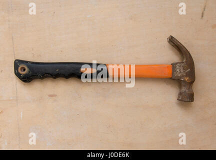 Grunge wood background with old hammer. Close Up Stock Photo