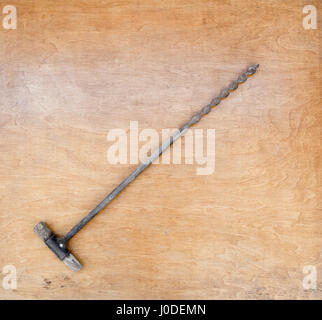 Vintage wooden hand drill on wooden background Stock Photo