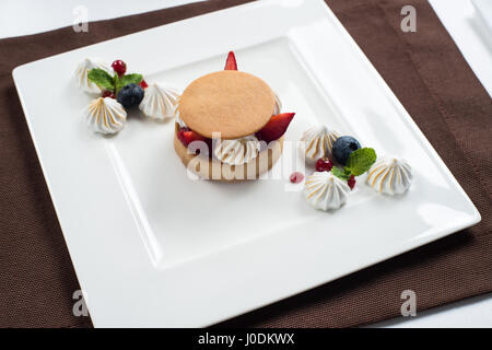 Strawberry and marshmallow yogurt cake on a white plate Stock Photo