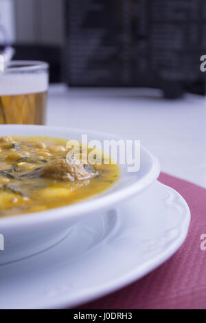 White dish with stew prepared for eating Stock Photo