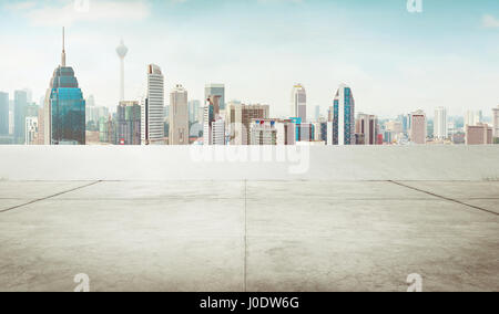 Empty cement roof top with modern city skyline . Stock Photo