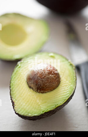 Cut avocado on white background Stock Photo