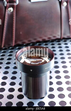 Vintage professional projection movie lens on metalic background Stock Photo