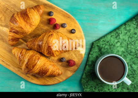 Crunchy French croissants with fresh fruit and chocolate Stock Photo