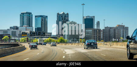 Birmingham, Alabama city skyline from I-20 approaching the downtown cityscape. (USA) Stock Photo