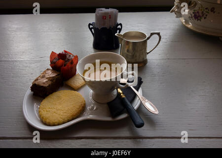 A café gourmand served in France. The dish is a coffee served with