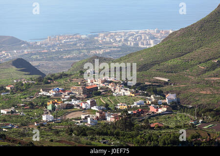 Southern side of Tenerife island with small villages at the mountains slopes and the Atlantic coast, aerial view from mirador. Canary islands, Spain,  Stock Photo