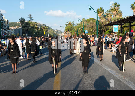 MALAGA,SPAIN-APRIL 09 2017:Unidentified woman walking in the catholic processions called Semena Santa in Malaga on April 09 2017, this processions are Stock Photo