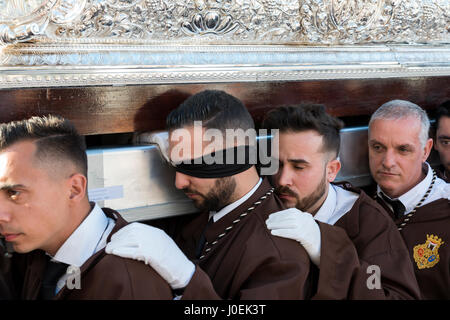 MALAGA,SPAIN-APRIL 09 2017:Unidentified people walking in the catholic processions called Semena Santa in Malaga on April 09 2017, this processions ar Stock Photo