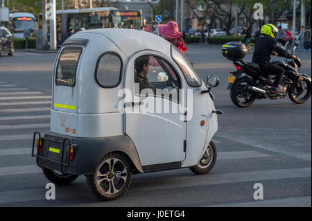 An unlicensed mini electric car is seen in Beijing, China. 11-Apr-2017 Stock Photo