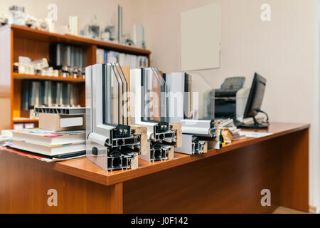 Exhibition sections wood aluminum windows with triple glazing on desk Stock Photo