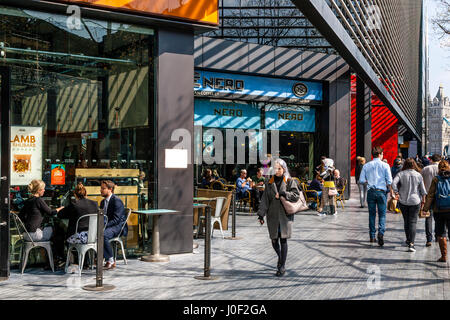 People Sitting Outside Cafes At The More London Development, London, England Stock Photo