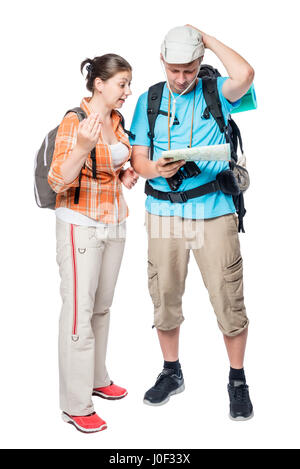 Two lost tourists look at the map on a white background in the studio Stock Photo
