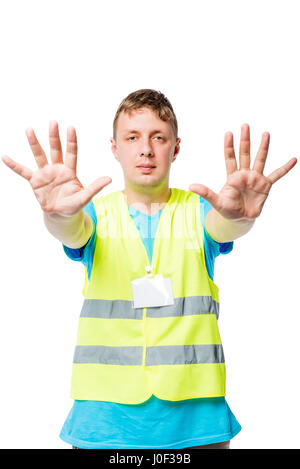Man in vest shows hands with gesture of STOP on white background Stock Photo