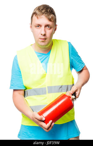 Worker in a vest with a fire extinguisher in hands on a white background Stock Photo