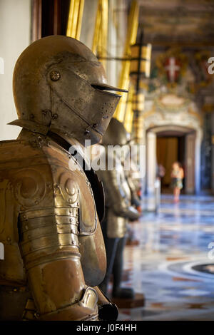 VALLETTA, MALTA - JULY 31, 2015:  The suits of armour in the armoury corridor on the main floor of the Grandmaster's Palace. Valletta. Malta Stock Photo