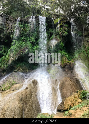 El Nicho Waterfalls in Cuba. El Nicho is located inside the Gran Parque Natural Topes de Collantes, a forested park that extends across the Sierra Esc Stock Photo
