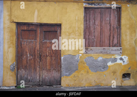 Wooden doorway and shuttered window  of old building in Garachico, Tenerife, Canary Islands, Spain. Stock Photo