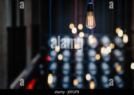 Single Retro Light Bulb Hanging from the Ceiling Stock Photo