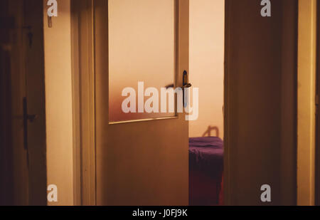 Three doors during night in an old retro home. Stock Photo