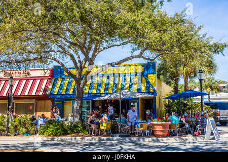 People dining at outdoor sidewalk cafe on Main Street in Sarasota Florida Stock Photo