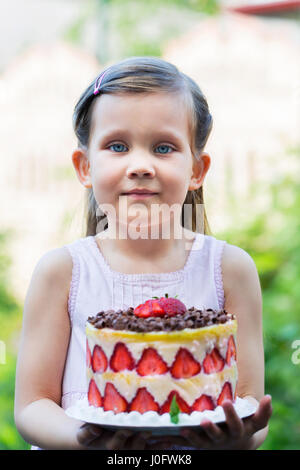 girl is holding french cake 'Fraisier' Stock Photo