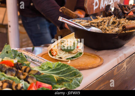 Shaurma. Pita bread with vegetables and cheese. Stock Photo