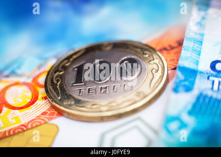 Kazakhstan money, close-up. Coin one hundred tenge and paper currency. Stock Photo