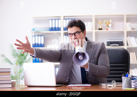 Angry aggressive businessman in the office Stock Photo
