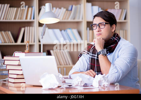 Young writer working in the library Stock Photo